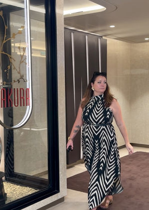 Woman walking past Sakura restaurant on Explora Journeys