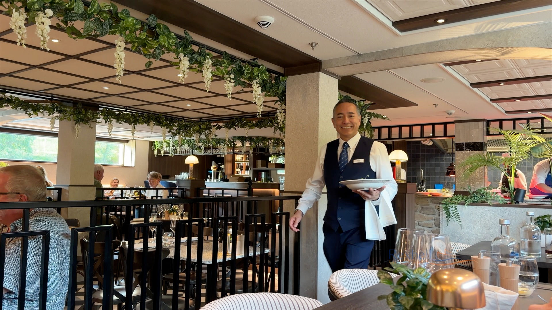 VIVA ENJOY review: waiter serving in the elegant restaurant
