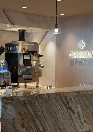 Crema Café interior and coffee machine on Explora Journeys