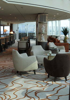 Modern lounge at Explora Journeys with ocean views.