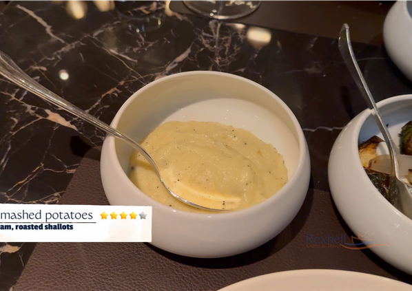 Creamy mashed potatoes with herbs in a white bowl