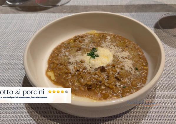 Porcini mushroom risotto with burrata espuma and cheese.