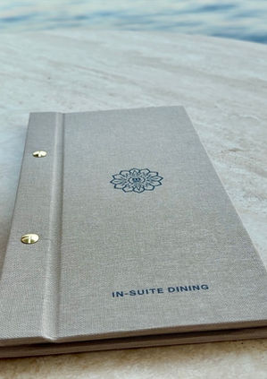 Explora Journeys In-Suite Dining menu on a table
