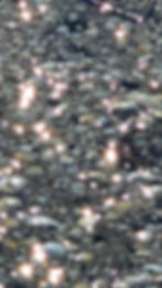 Water so clear it appears not to be there, but for the sun's reflection