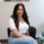 Provider. Smiling woman sitting in a clinical setting for Spravato.