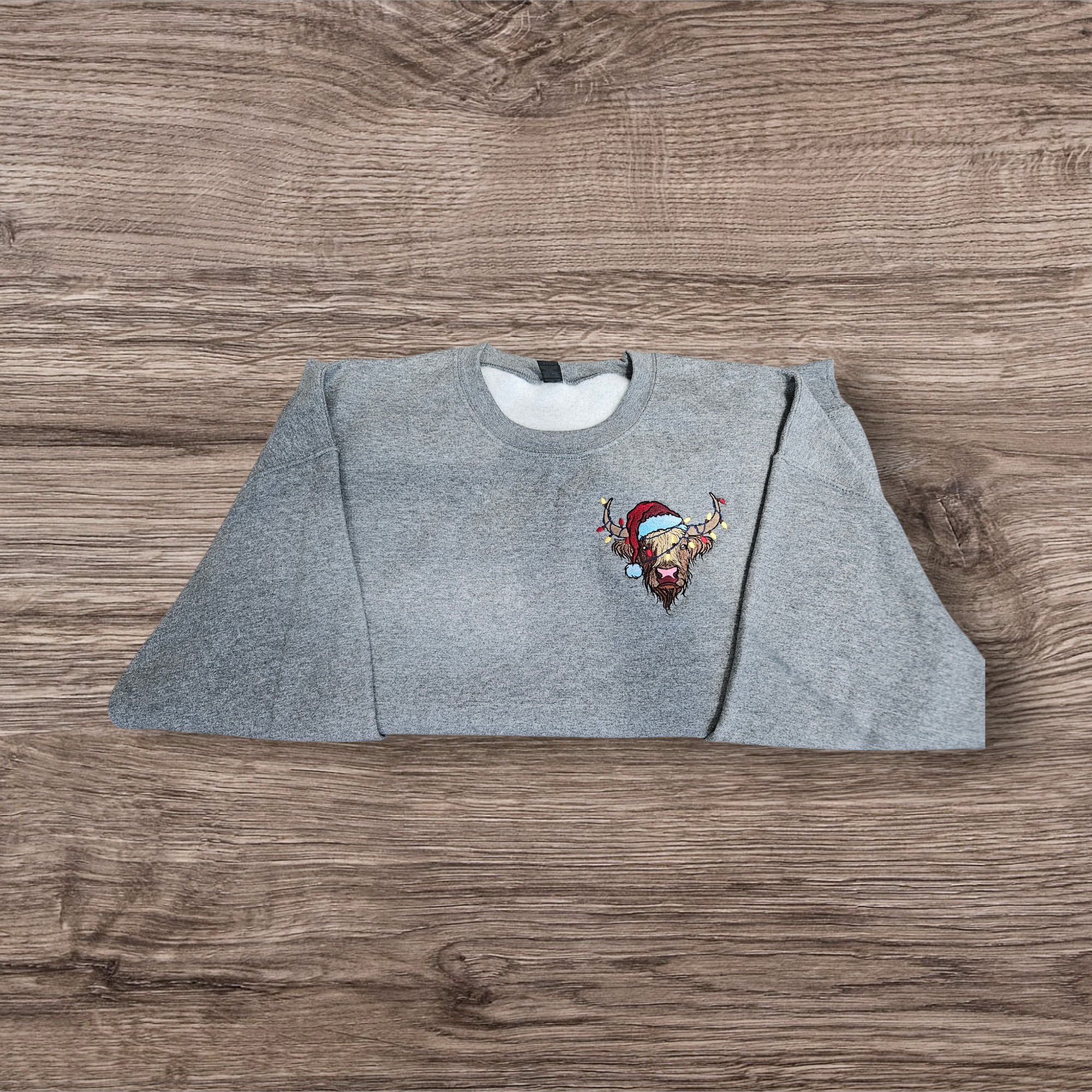 Highland Cow embroidered sweatshirt. Christmas cow with lights