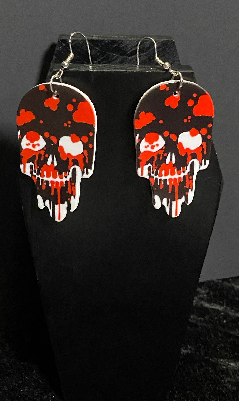 Thumbnail: melting skull resin earrings