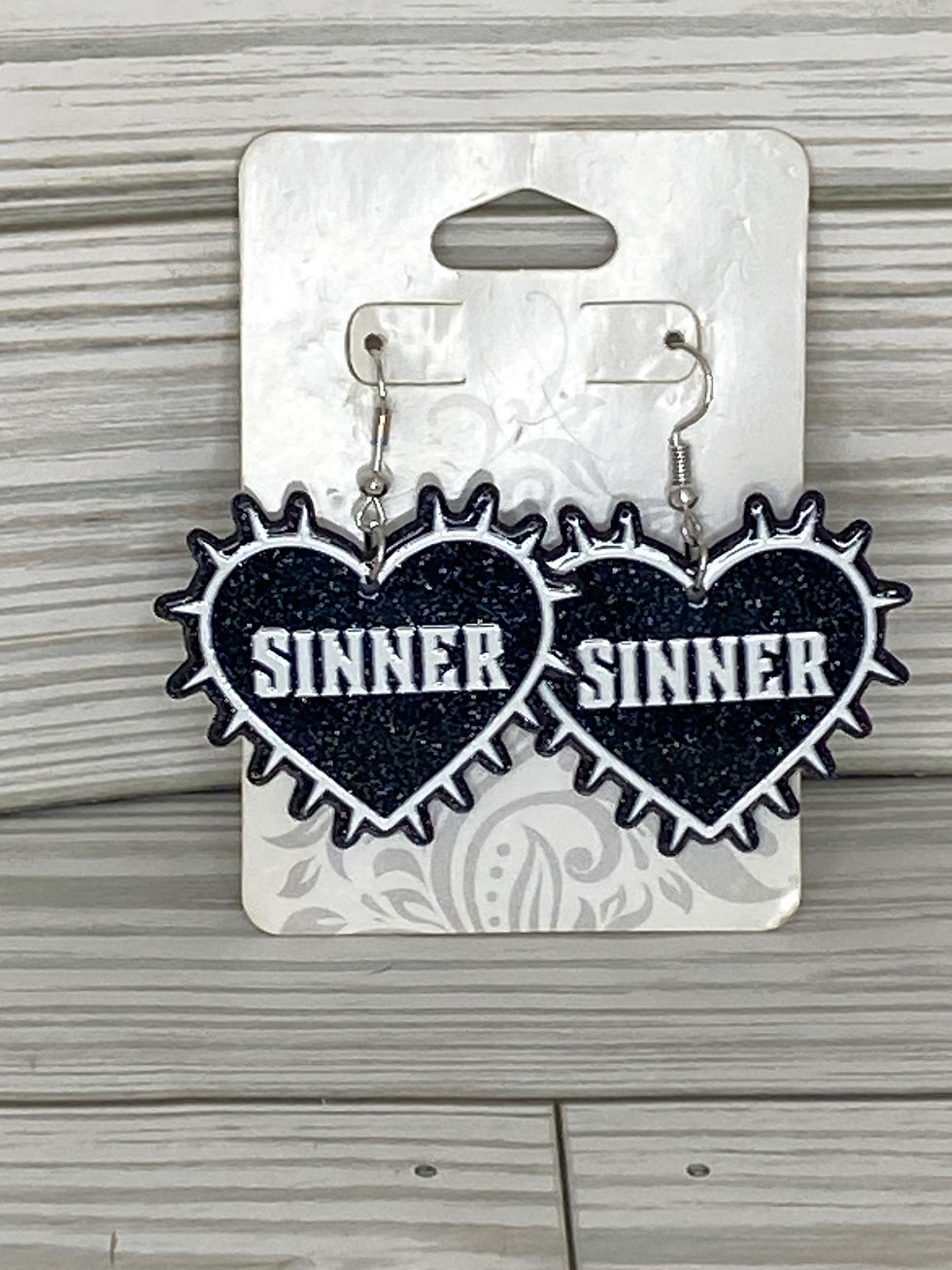 Thumbnail: Sinner resin heart earrings