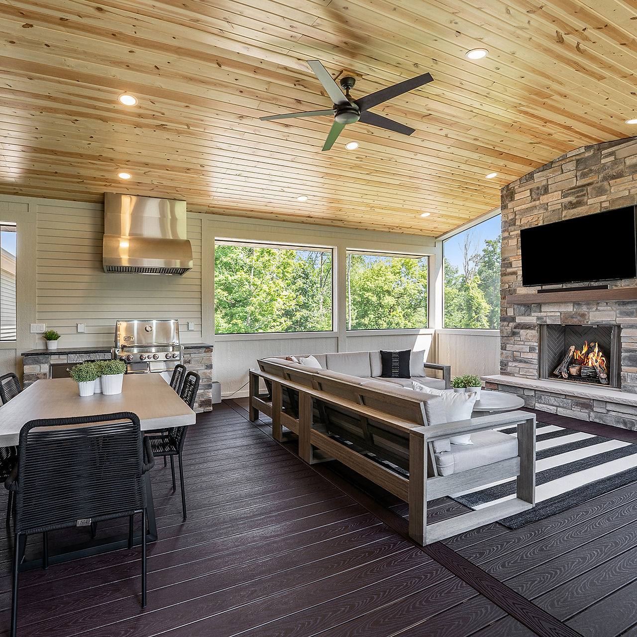 three season room with gas stove and fireplace