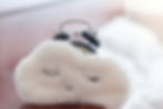 Alarm clock covered in a soft fluffy cloud, asleep