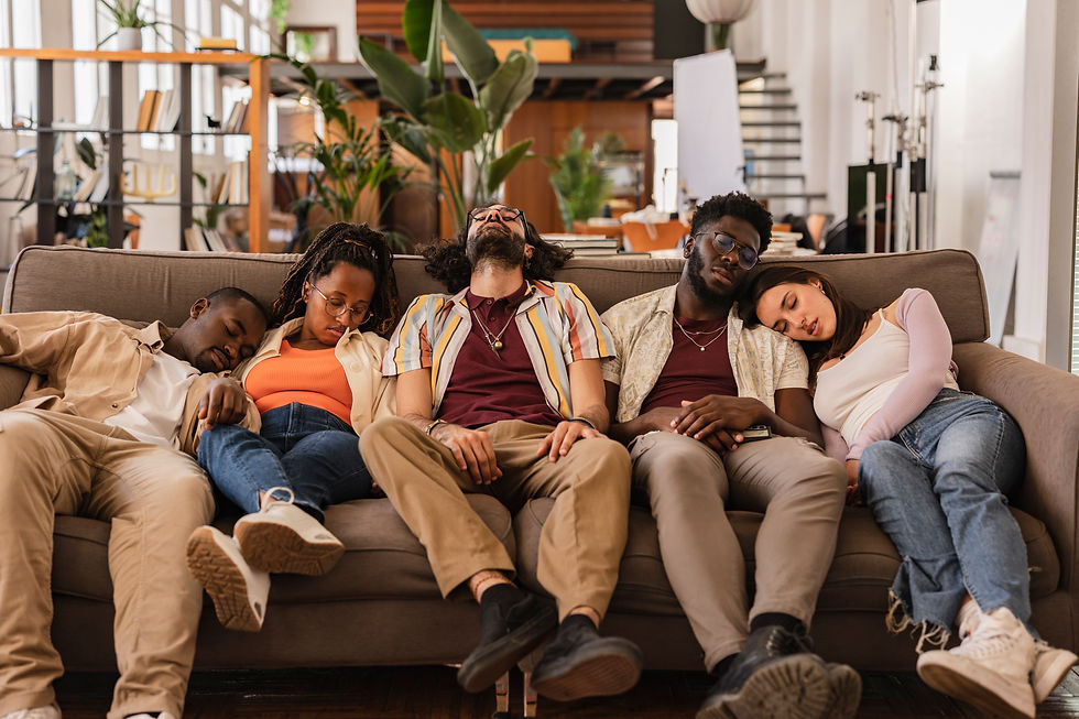 Teenagers asleep on the sofa