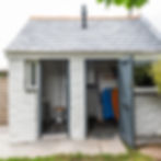 Outdoor storage for beach equipment and rack for wetsuits. WC, basin and outdoor shower.