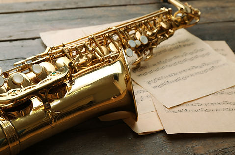 Beautiful golden saxophone with musical