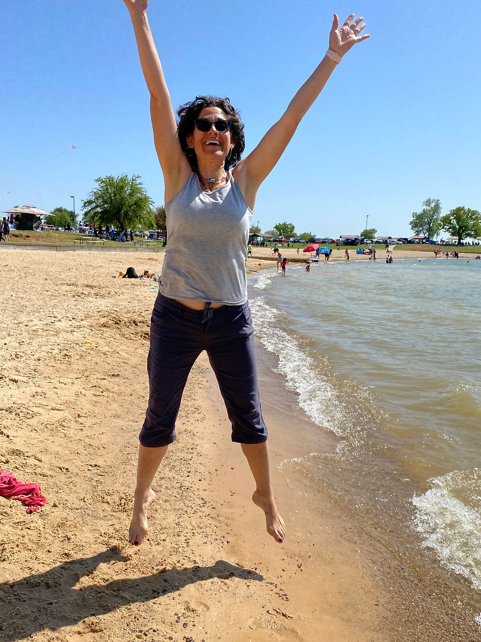 Marlene jumping up in the air, unapologetically playful.