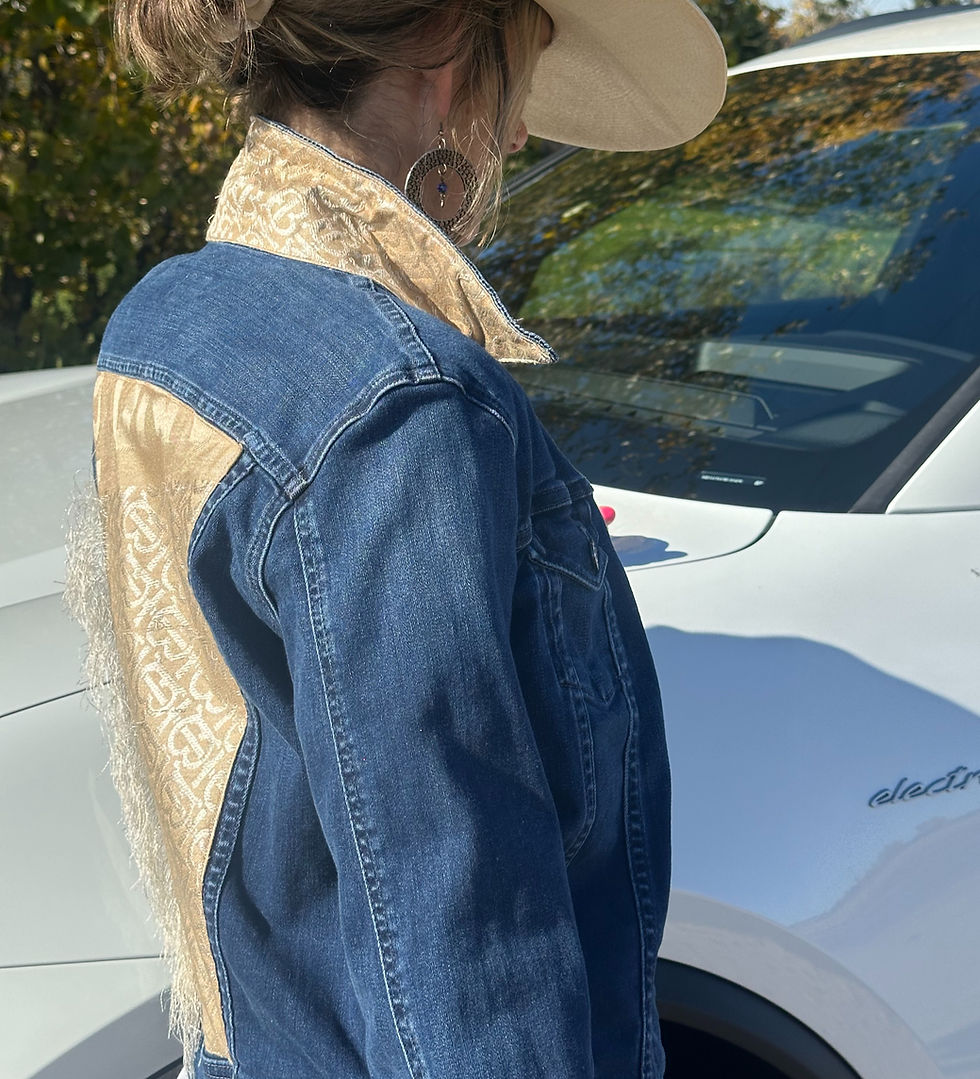 Thumbnail: A side view of a Go Coco! jean jacket with a unique Burberry scarf sewn on it