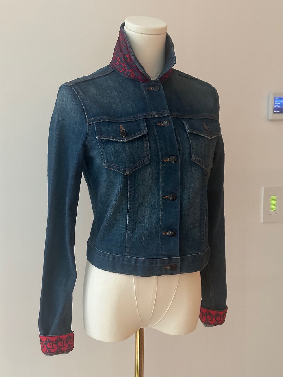 Thumbnail: The front view of a denim jacket with a Christian Dior scarf sewn on it