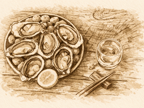 A tray of oysters with a glass and chop sticks