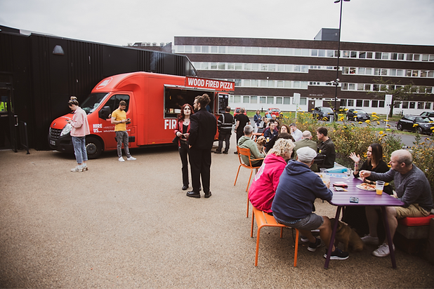 Beer festival 2025 showing guests in the courtyard and wood fired pizza food truck