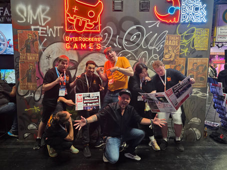 parts of the team in front of our gamescom booth