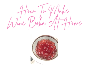 Pink text reads "How To Make Wine Boba At Home" above an image of red boba pearls in a strainer, set on a white background.