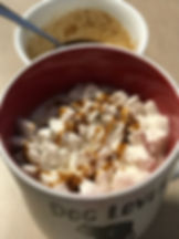Caramel sauce is drizzled on top of whipped cream