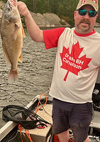 Customer wearing Grade Eh Canadian Unisex Tshirt. Red maple leaf, red sleeves so the shirt looks like the Canadian flag