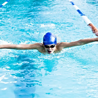 Our Year 6 Student doing the butterfly stroke in the Kennedy House School pool.