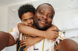 Son with Hugging Father with Hands Around Neck