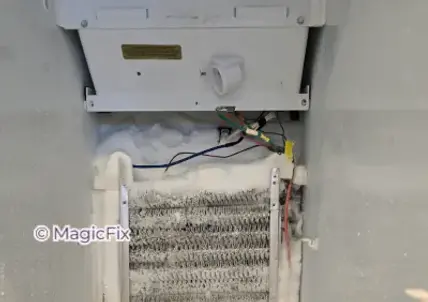 This GE refrigerator had excessive frost buildup around the evaporator coil because of a failed evaporator fan motor. We replaced the fan motor and confirmed that the refrigerator returned to normal cooling.