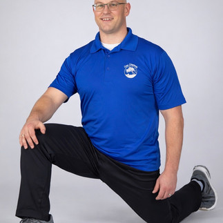 A person demonstrating proper abdominal bracing and foundational core stability exercises to prevent lower back pain.