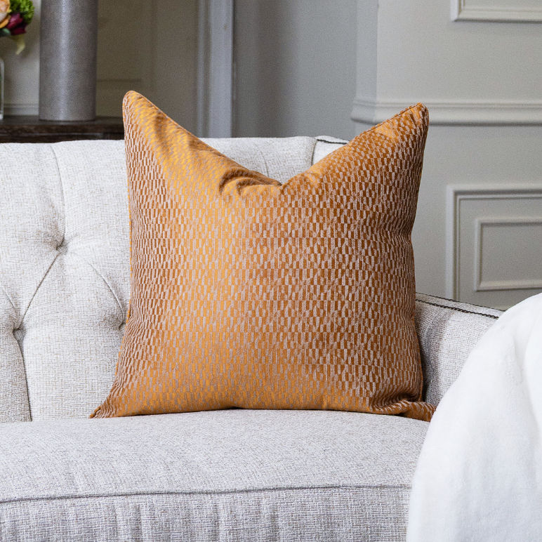 Mustard yellow GOLDEN CANYON PILLOW on couch