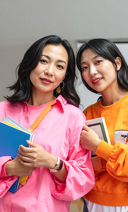 Firefly_asian women wearing orange or hot pink clothing adult students with books, supplie