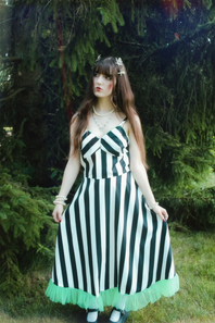 Model wearing Retro Stage vintage clothing outside in forest setting, E-Commerce fashion.