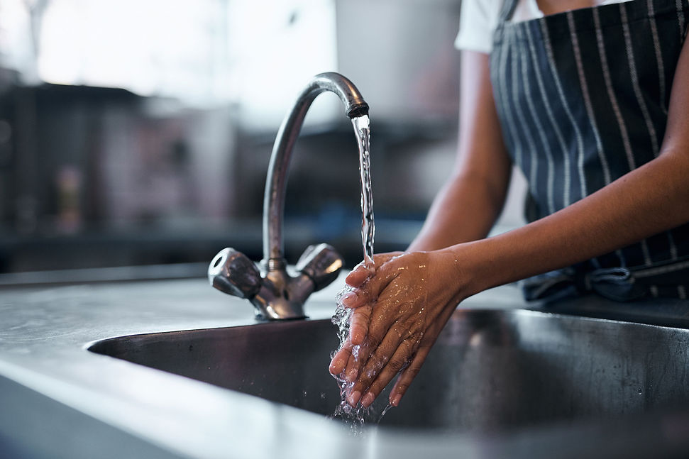 woman-washing-hands-in-kitchen-sink.jpg