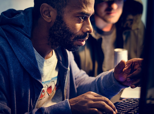african-descent-man-working-with-computer-laptop-2022-12-16-00-11-58-utc.jpg