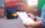 stock-photo-logistics-manager-reviewing-documents-at-a-shipping-yard-with-a-forklift-and-c