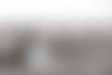 Bride and groom in a field. A glorious Farm Wedding in Aldbourne, Wiltshire.