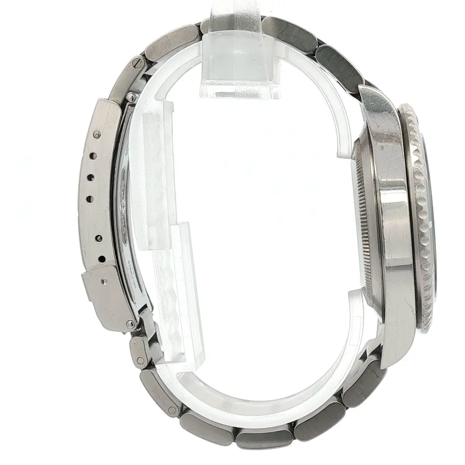 Rolex Submariner de acero inoxidable con esfera verde y bisel, reloj de lujo. Boué Joyeros.