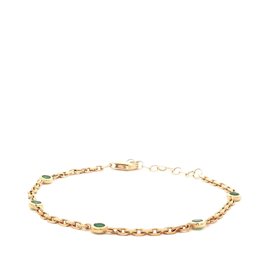 Pulsera dorada con piedras verdes. Boué Joyeros.