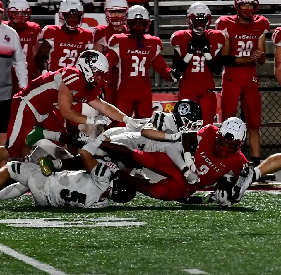 Koy Beasley (9) is stopped after a short gain for LaSalle at the La Salle vs. Louisville-T