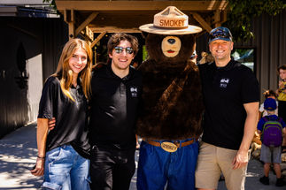 WUI Productions team taking a picture with Smokey the Bear.