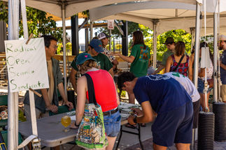 A medium image of people enjoying a booth at the Burn to Bloom event.
