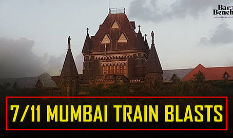 Gothic-style building under cloudy sky, overlaid with text: "7/11 Mumbai Train Blasts." Dark, somber mood.