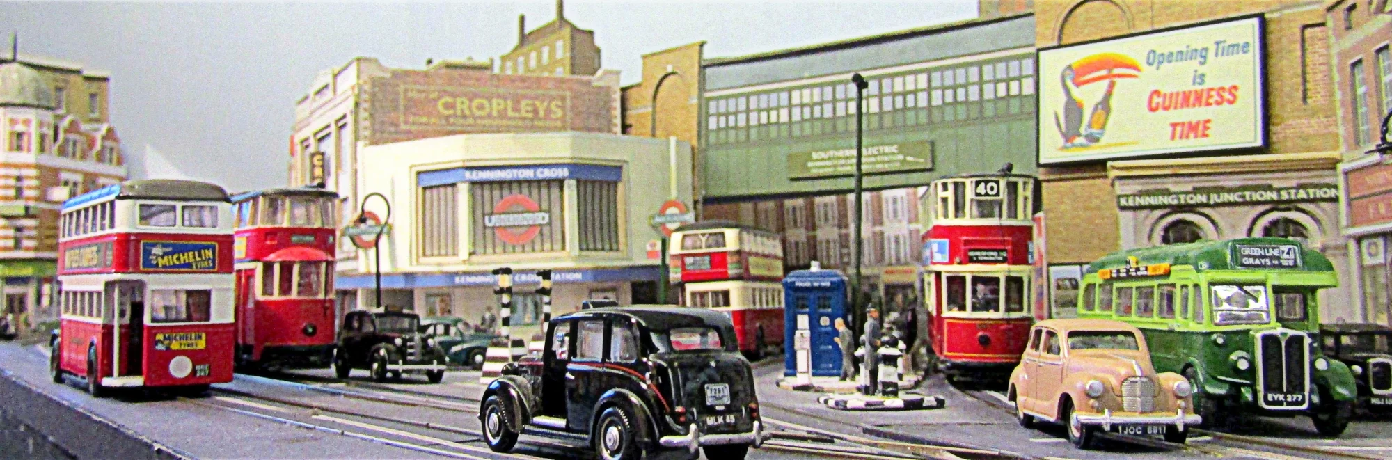 A 1/76 scale city scene showing London Transport buses and trams and an Underground station in 1950. Card models of real buildings from the Kingsway Models range.