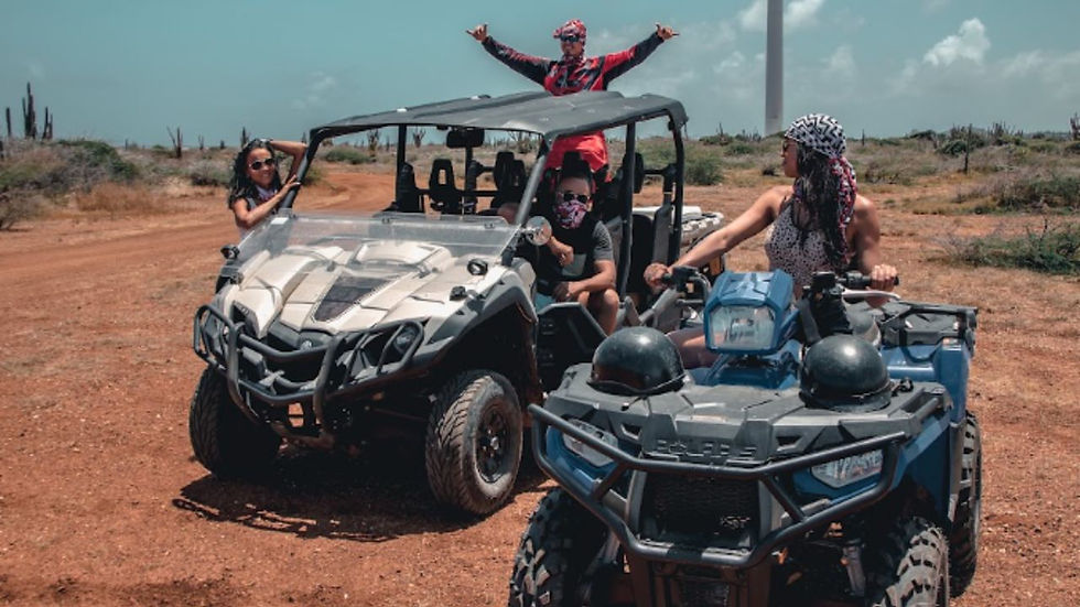 ATV and buggy adventure tour near Curacao's wind turbines and desert landscape