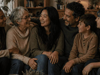 Individual sitting with family members showing connection despite differences
