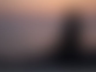 A calm peaceful person sitting quietly in reflection with soft lighting, practicing a mental reset and mindfulness to restore inner calm.