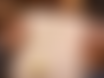 Hands editing a poem draft with highlighted rhyme patterns and revisions