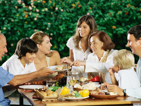  Extended family members sharing laughter and conversation together.