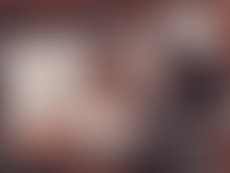 A person writing in a journal at eye level, focusing on the act of self-reflection